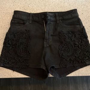 Worn once Guess high waisted floral detail black shorts has a gloss kinda shiny
